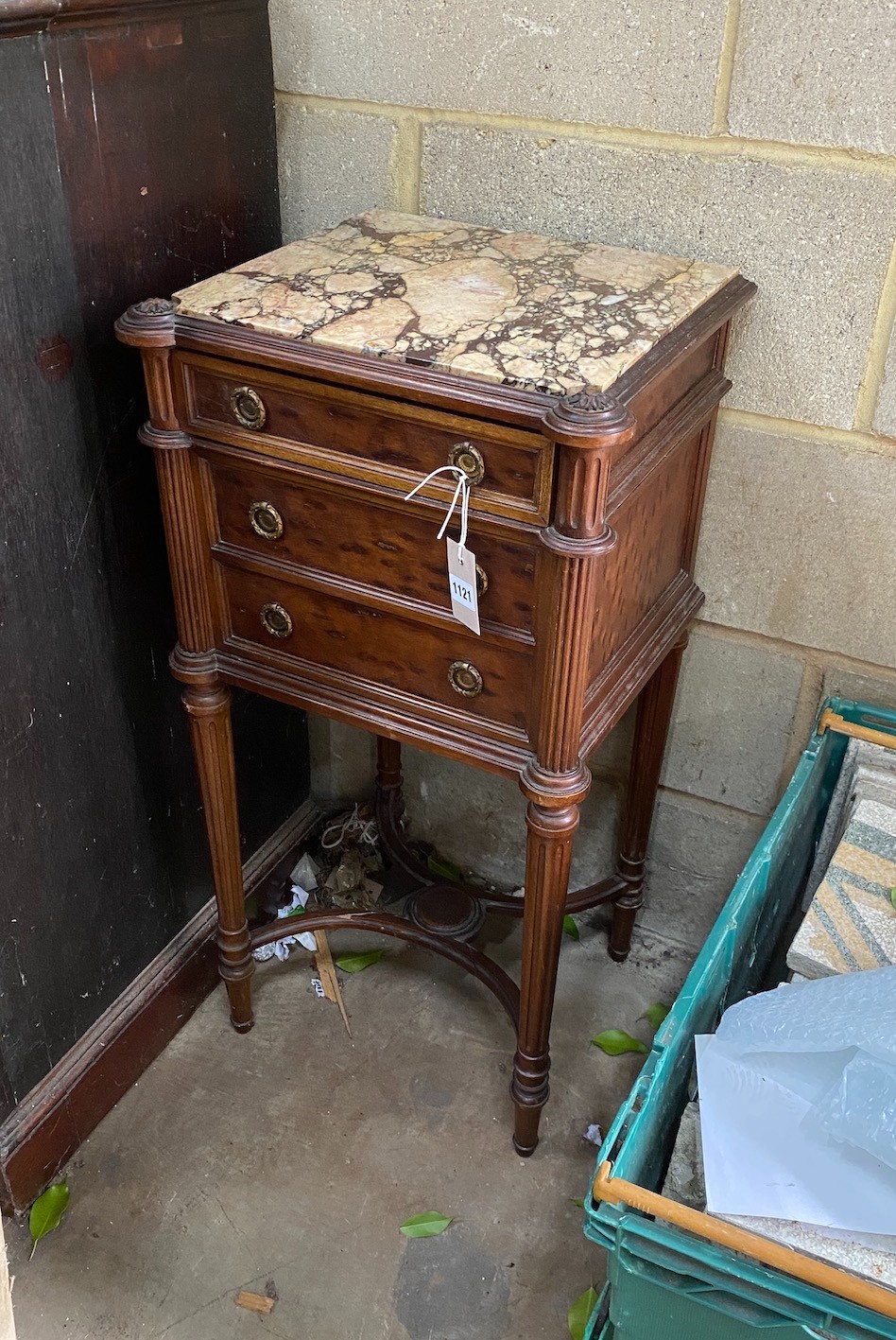 An early 20th century French marble topped mahogany bedside cabinet, fitted with a single drawer above a pot cupboard disguised as two drawers, 84 cm high, 42 cm wide 37 cm deep
